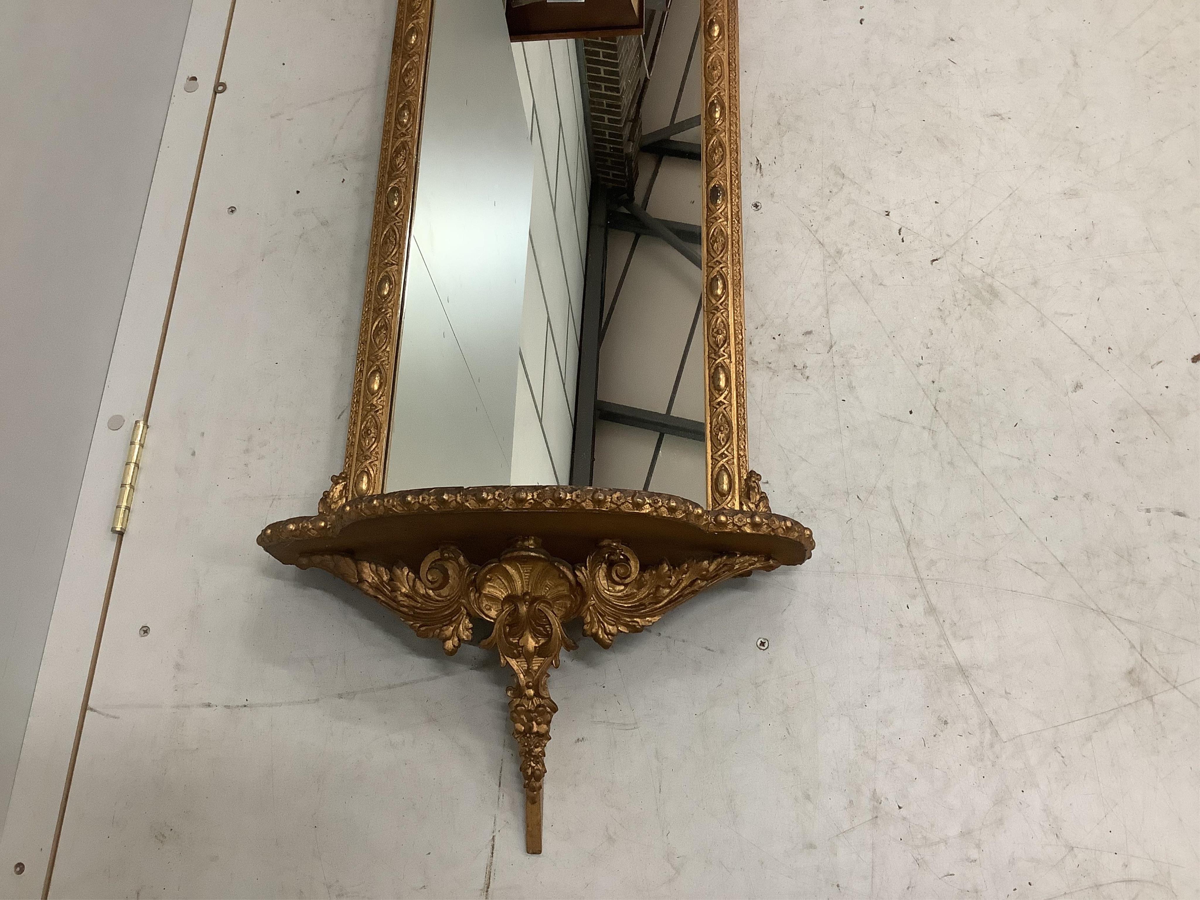 A Victorian giltwood and composition pier glass, width 46cm, height 110cm. Condition - fair